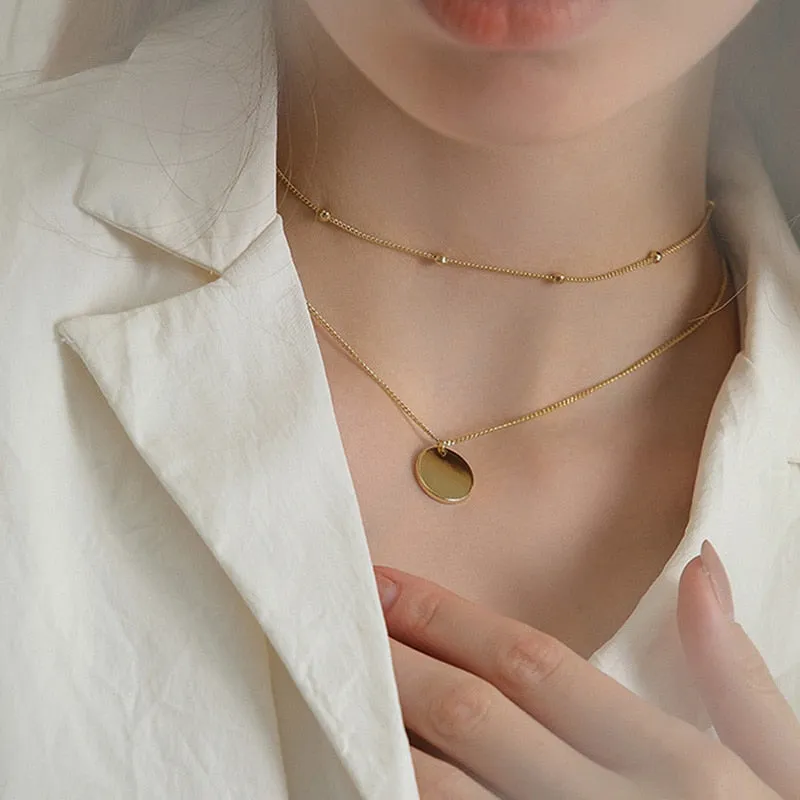 Vintage necklace on neck Gold chain